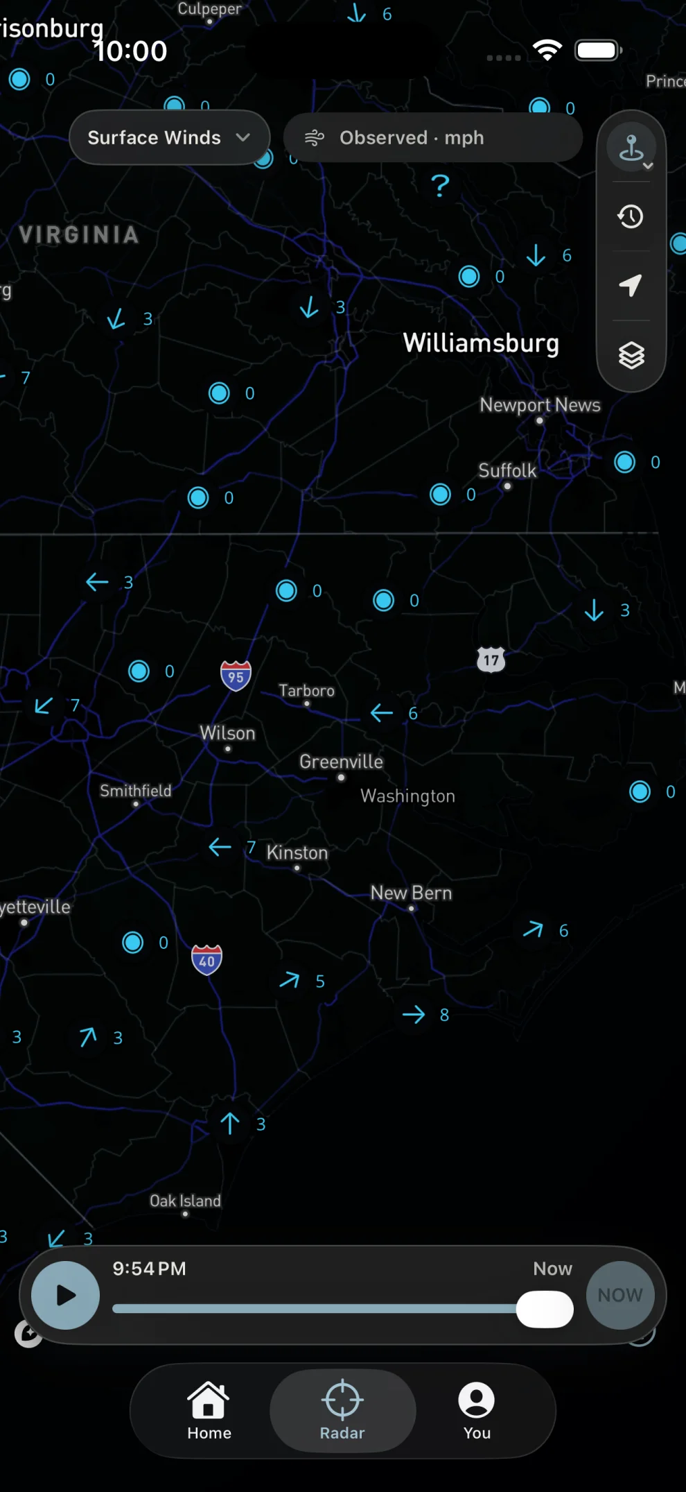 Surface wind observations with direction arrows and speeds across eastern North Carolina.